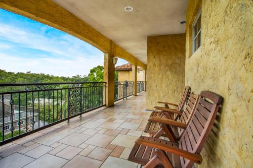 a balcony with two wooden chairs and a view at Ocean Lodge Resort in Demere Park