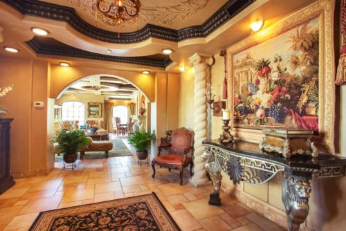 a living room with a large painting on the wall at Ocean Lodge Resort in Demere Park
