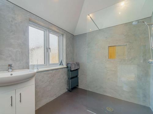 a bathroom with a sink and a shower at 1 Bed in Llandudno 83621 in Llandudno