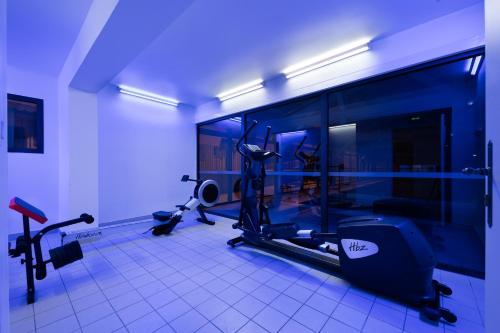 a room with a gym with machines in it at Garden & City Mont-Ventoux Malaucène in Malaucène