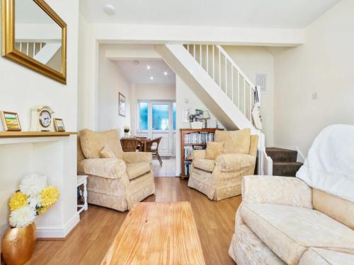 a living room with a couch and chairs at Pass the Keys 55 Heworth Village Wonderfully Cosy Family Home in York in York
