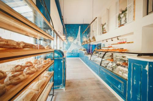 a bakery aisle with blue counters and pastries at Luxury 1 Bed in Longbeach in Iskele