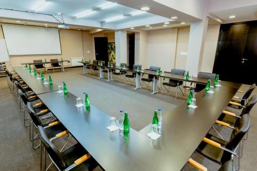a conference room with a long table with bottles on it at Nobel Gallery Hotel in Belgrade