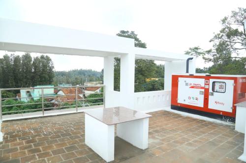 a gas station on the roof of a house at Hotel Misty Haven Retreat in Yercaud
