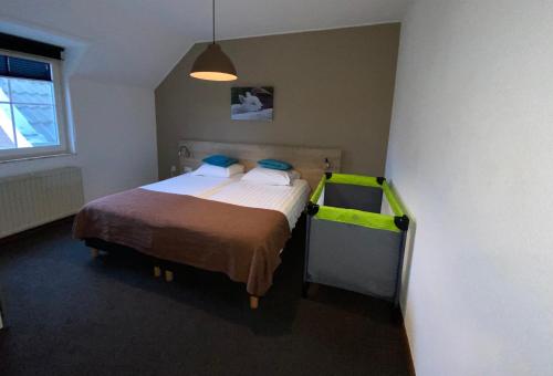 Appartementen De Zegelskoëlにあるベッド