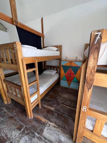 a bunk bed room with two bunk beds in it at Santa Lova Eco-hostel Isla Tintipan in Tintipan Island