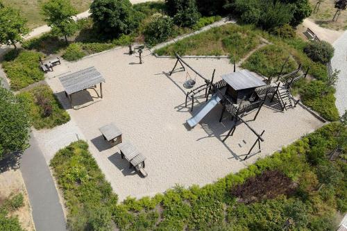 an aerial view of a park with a playground at Apartmenthaus Scharmützelsee inkl Nebenkosten in Wendisch Rietz