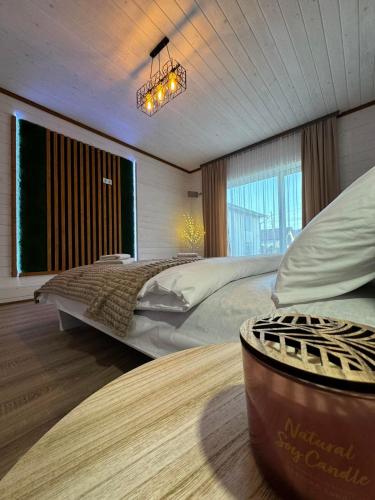 a large bedroom with two beds and a large window at Welcom Verkhovyna in Verkhovyna