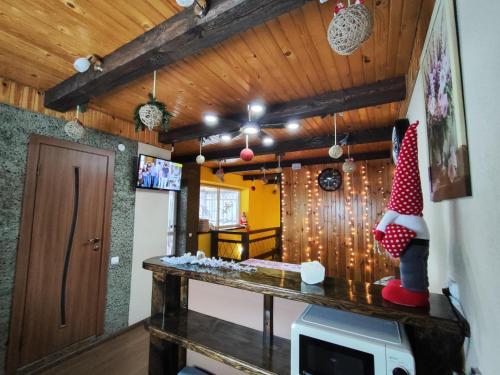 a room with a table with a christmas gnome on it at Карпатський куточок in Slavske