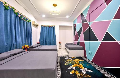 Ένα ή περισσότερα κρεβάτια σε δωμάτιο στο Penang Dream Banglo Events up to 120 Pax