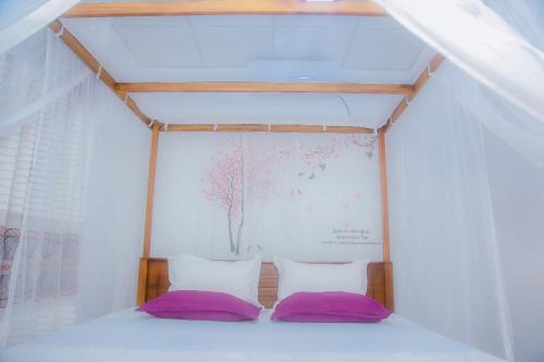 Ένα ή περισσότερα κρεβάτια σε δωμάτιο στο Rangi Villa