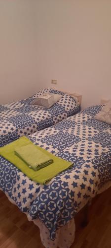 En eller flere senge i et værelse på Casa de Enkiu