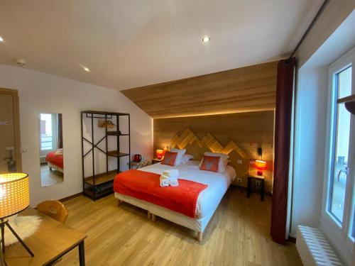 Postel nebo postele na pokoji v ubytování Hôtel du Grand-Mont