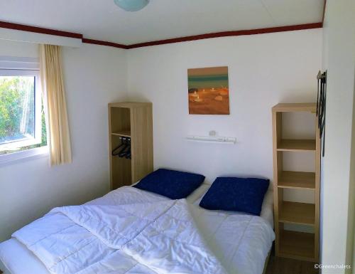 En eller flere senge i et værelse på Greenchalets Frejus Saint Aygulf