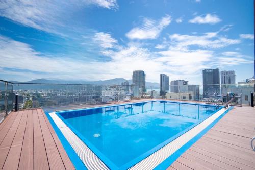 a swimming pool on the roof of a building at Hai Trieu Hotel in Da Nang