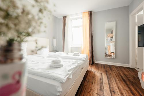 Hotel 'Das Strandhaus'にあるベッド