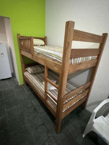 a couple of bunk beds in a room at Quarto Central in Guararema