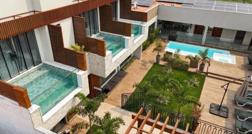 an aerial view of a house with two swimming pools at Pousada Villas - Bonito in Bonito