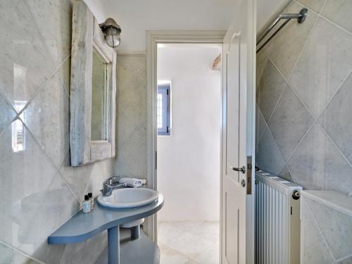 a bathroom with a blue sink and a shower at Cycladic Villa, Blue Stories in Santa Marina