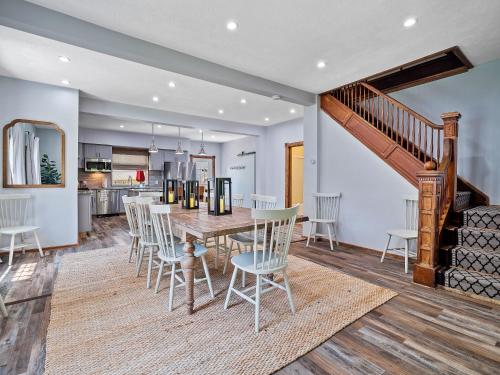 a dining room and kitchen with a table and chairs at Welcome To Wine Country - Relaxed Luxury in Geneva