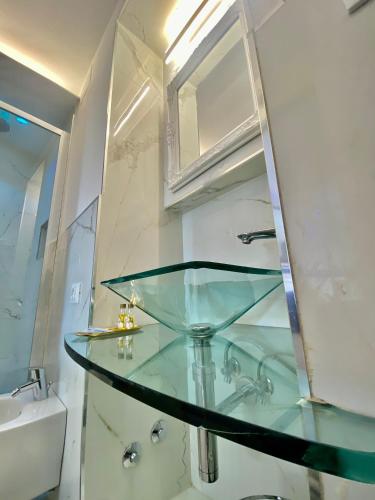 a glass counter in a bathroom with a sink at The Manarola Main Plaza in Manarola