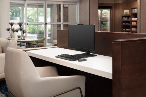 a computer monitor sitting on a desk in an office at Fairfield Inn & Suites by Marriott Ithaca in Ithaca
