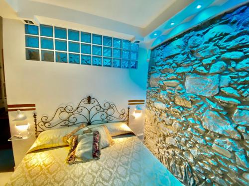 a bedroom with a fish mural on the wall at The Manarola Main Plaza in Manarola