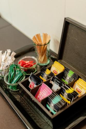 a box filled with different types of food on a table at Logis Hôtel Des Acacias Lille Neuville en Ferrain, Restaurant l'Acacias Gourmand in Neuville-en-Ferrain