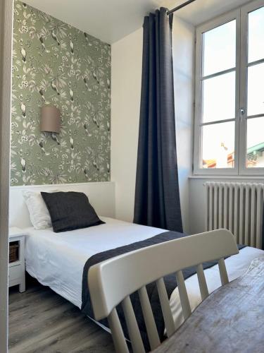 Hôtel Parc Mazon-Biarritzにあるベッド