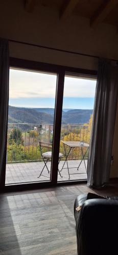 a room with a large window with a view at Agriturismo La Pina in Tarzo