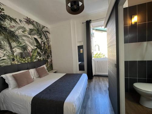 Hôtel Parc Mazon-Biarritzにあるベッド