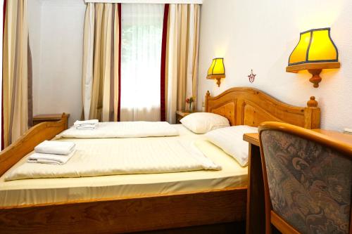 Ένα ή περισσότερα κρεβάτια σε δωμάτιο στο Haus am Walde