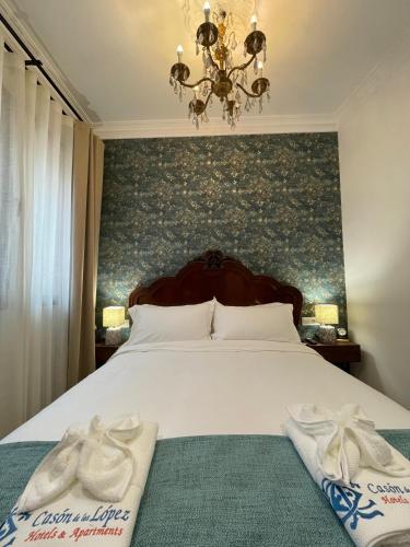 Ένα ή περισσότερα κρεβάτια σε δωμάτιο στο Casón De Los López Apartments