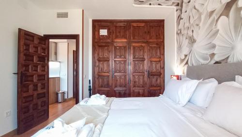 Ένα ή περισσότερα κρεβάτια σε δωμάτιο στο Casón De Los López Apartments