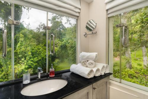 a bathroom with a sink and a window at Villa Vajrapani in Kandy