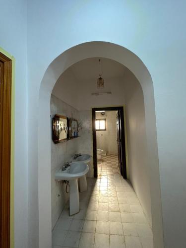 a bathroom with a sink and two sinks in a room at شقة مؤثثة , 10د بالسيارة و 20د مشياً للحرم in Al Madinah