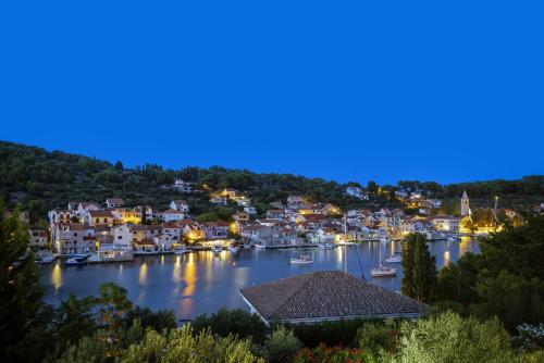 a view of a harbor at night at Marceline in Prvić Luka