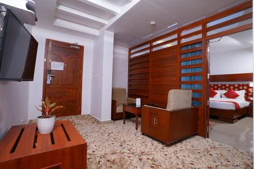 Postel nebo postele na pokoji v ubytování Empire Residency