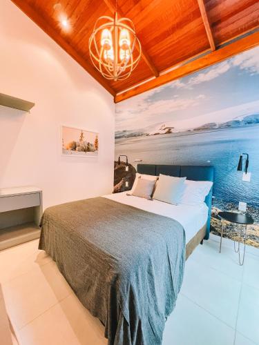 a bedroom with a bed and a view of the ocean at Casa Cancun Hotel Boutique & Eventos in Penha