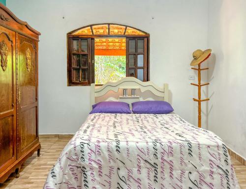 מיטה או מיטות בחדר ב-Chacara com lazer e conforto em Joanopolis SP