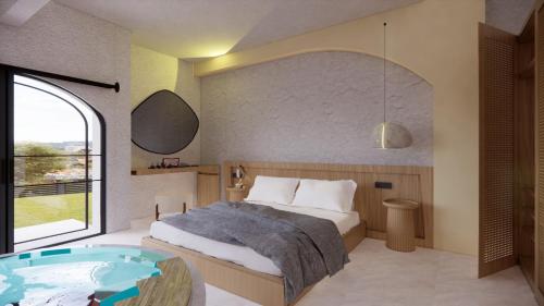 a bedroom with a bed and a tub in it at Unsal Hotel in Oludeniz