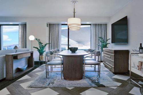 a rendering of a dining room with a table and chairs at Hilton Omaha in Omaha