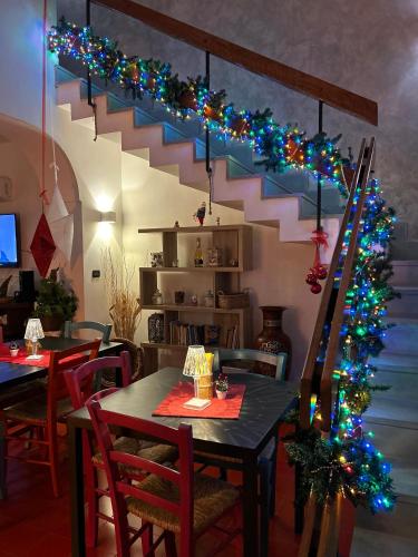a dining room with a table and a christmas tree at Villa Anna GuestHouse in Brindisi