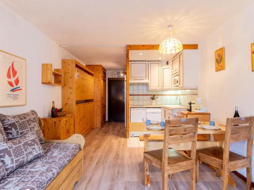 a living room with a couch and a table at Apartment Le Prariond-4 in Tignes