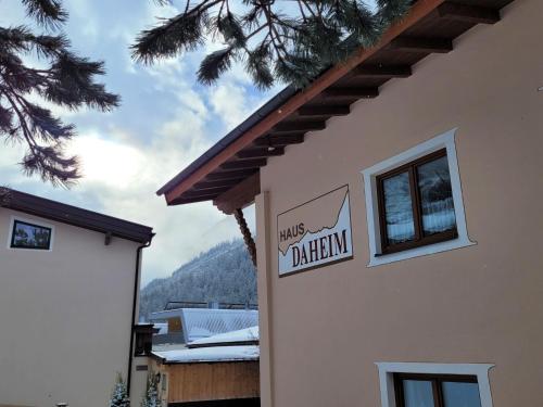 a sign on the side of a building at Apartment Daheim – Bergliebe by Interhome in Plangeross