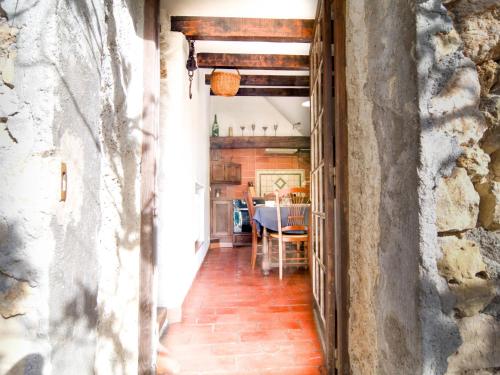 a hallway with a dining room and a table at Holiday Home Chez Canard by Interhome in Ampus