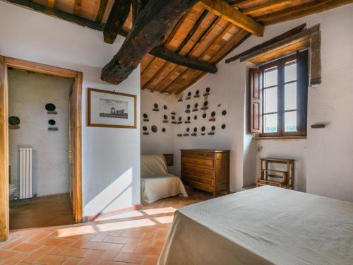 a large room with a bed and a window at Apartment Malva by Interhome in Sorano