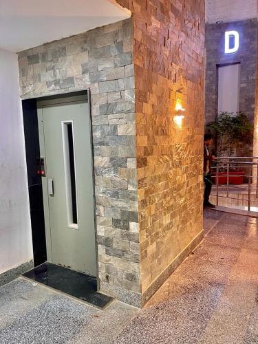 a building with a stone wall and a door at Sun gate house in Cairo