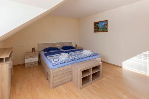 a small bedroom with a bed in a attic at Apartment Pr' Kavač in Rateče