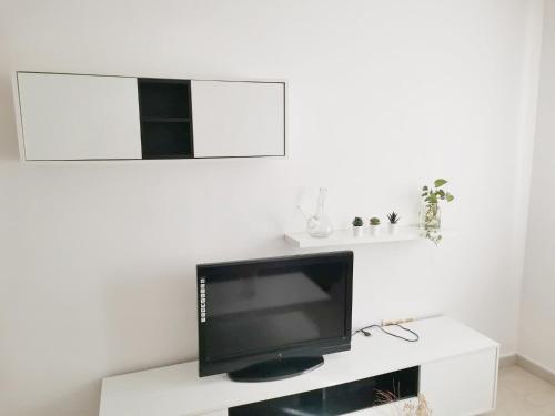 Et tv og/eller underholdning på Apartamento Triana